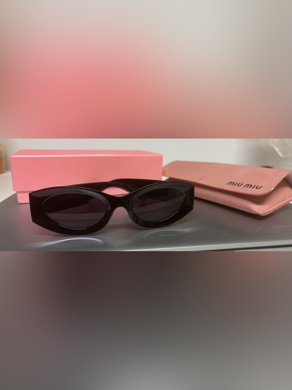 Miu Miu Black Oval Sunglasses with Gold Accent - Picture 2 of 7